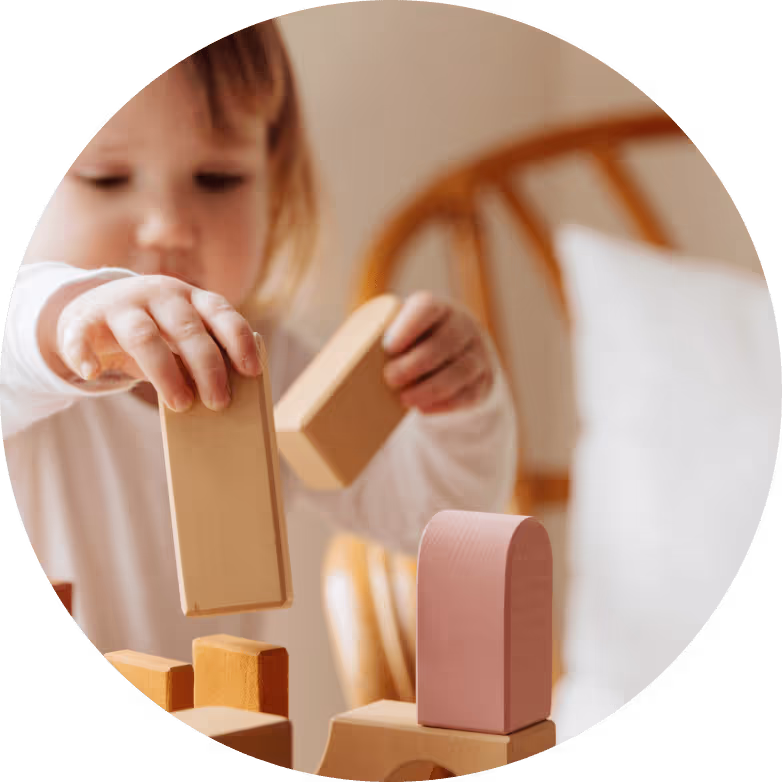 Child playing with wooden blocks