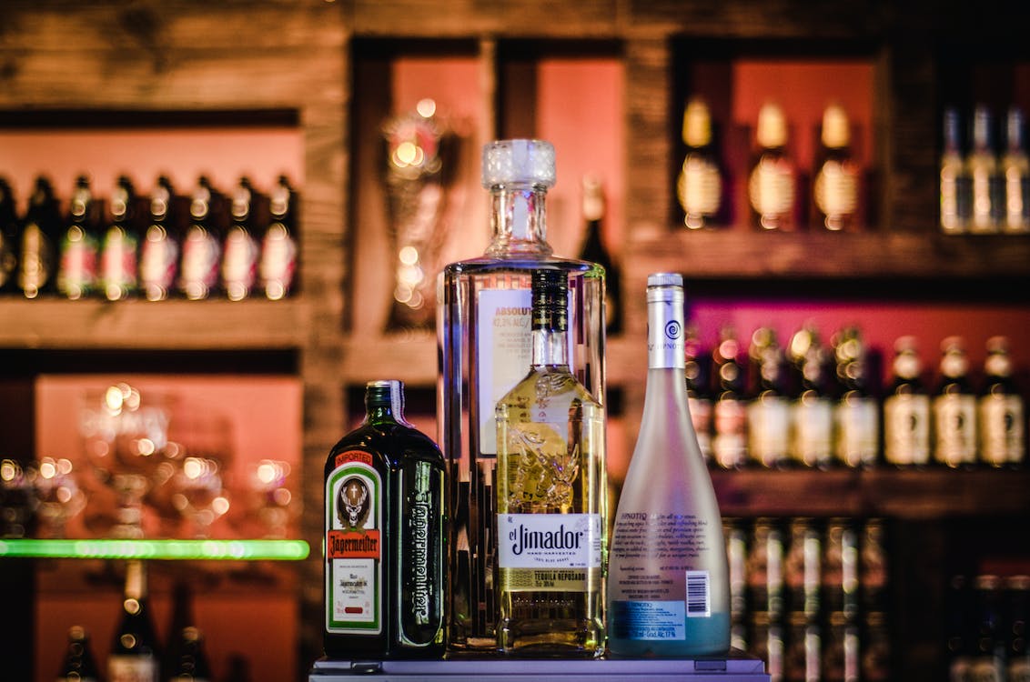 Free Four Assorted Liquor Bottles Stock Photo