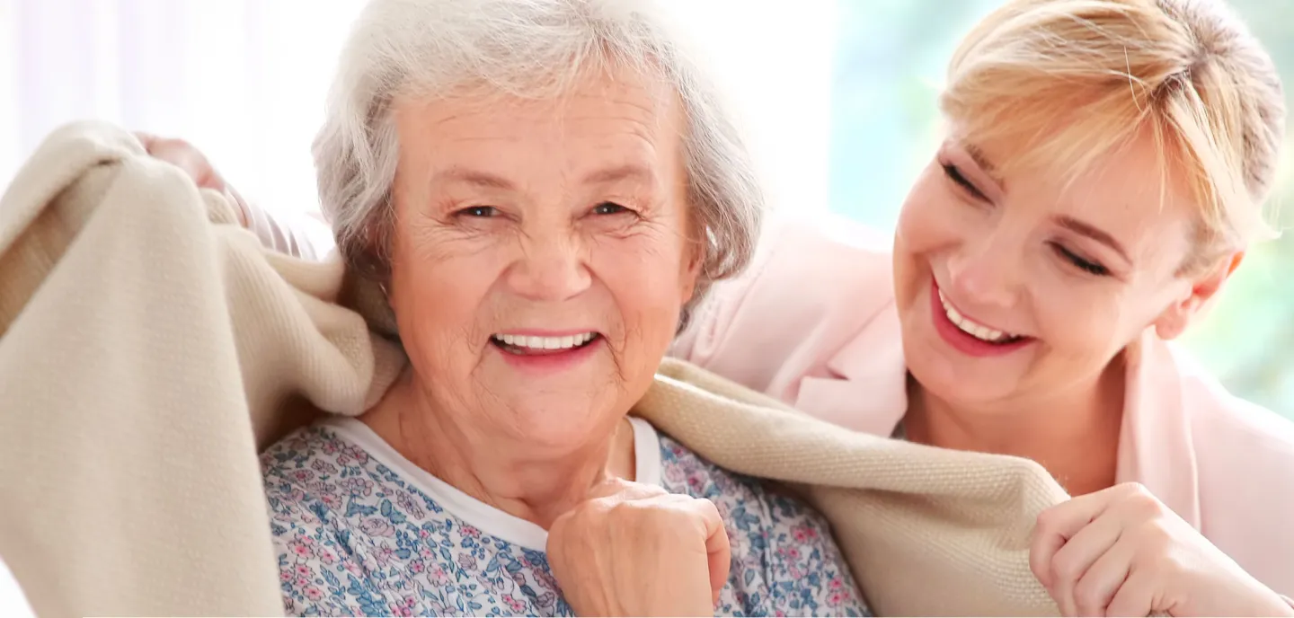 Image 5: A woman along a elder person smiling