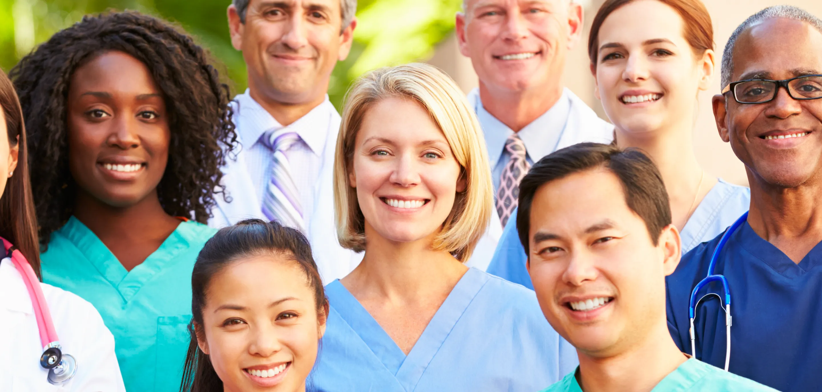 Image 10: A group of medical professionals smiling to the camera