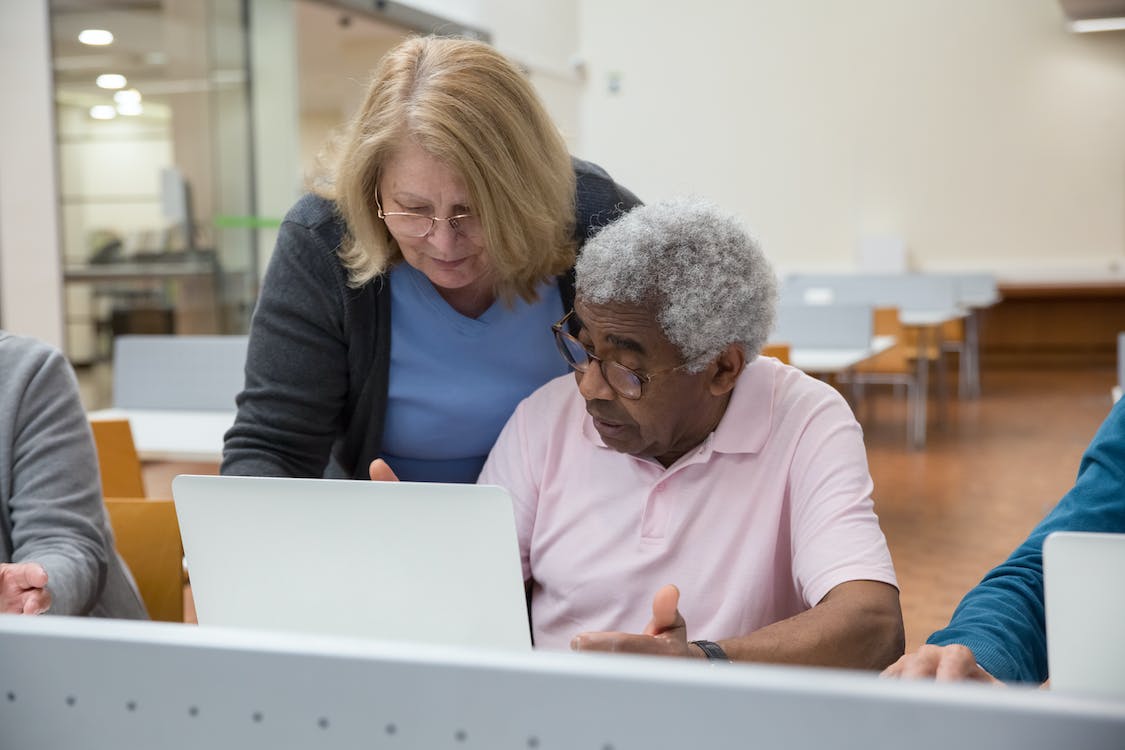 Free Elderly People Sitting in a Classroom and Using Computers Stock Photo